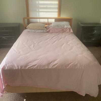 Full size bed in the right bedroom. Looks new