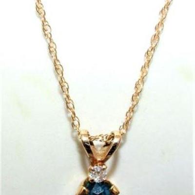 Lot 001
14K gold necklace blue stone