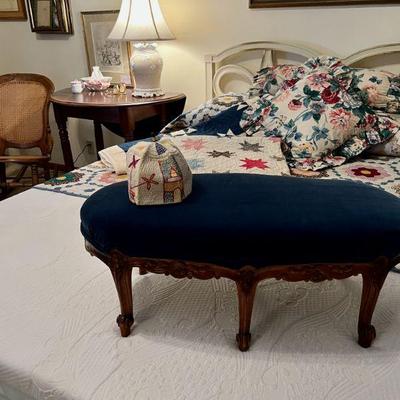Velvet footstool and antique quilts