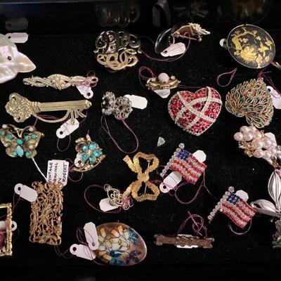collection of vintage costume jewelry incl. pins and brooches