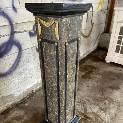 $200 marble and golden pedestal	
