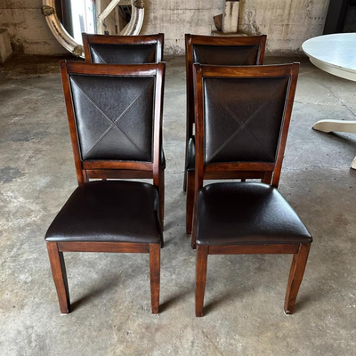 $80 black leather and wood dining chairs	