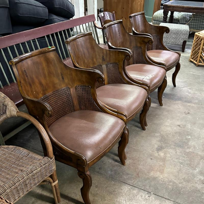 $100 leather wood and cain dining chairs	