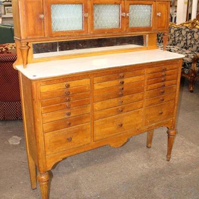 112: Antique mahogany multi drawer dental cabinet with original milk glass top and glass front approx. 50