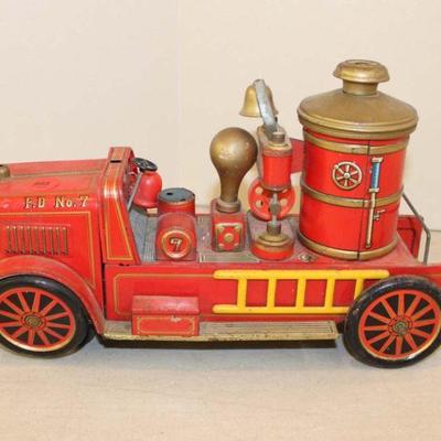338: Vintage Mark pressed tin battery operated fire truck, unknown if working approx. 12" w x 4" d x 7" h
