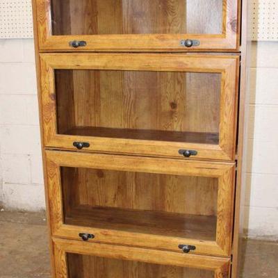 124: Barrister style 1pc 4 door bookcase in the pine finish approx. 29