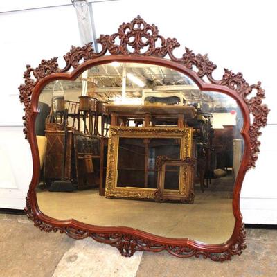 200: Vintage highly carved and ornate mahogany decorator mirror approx. 50" w x 48" h