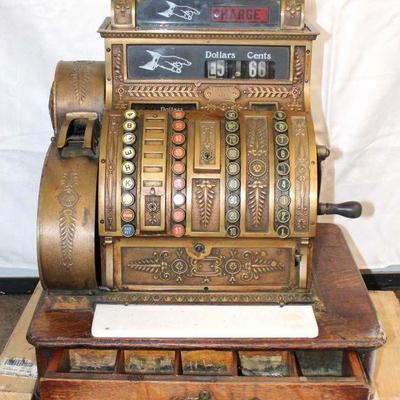 328: Antique National brass cash register on oak base, white glass is broken, missing top sign, as found condition approx. 20" w x...