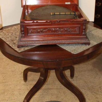 321: Antique Regina 15" disc music box player in fancy carved mahogany case with 28 discs, combs are in good condition, has original...