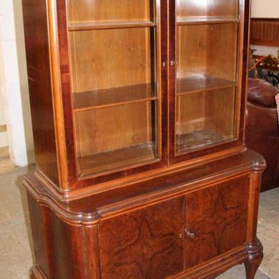174: Semi antique burl walnut 2pc china cabinet with bevel glass and key approx. 46