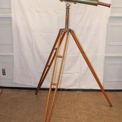 324: Abercrombie and Fitch decorative brass telescope on tripod, Lens is cracked approx. Telescope: 4" diameter x 46" h Overall...