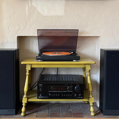 Sony record player, Polk Audio floor standing speakers, and Onkyo reciever