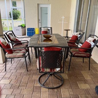 Patio set with six chairs two of them swivel table to 67 Long by 43 wide