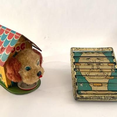 Vtg. Japanese tin-litho windup dog in doghouse, working condition (on left).  On right, APEX funny-faced tin litho toy. 