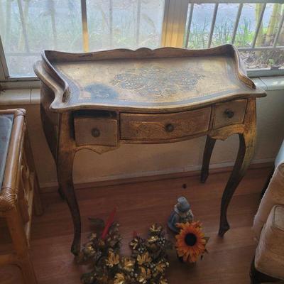 Ornate writing table with drawers