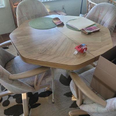 Nice table, with an extra leaf and four chairs