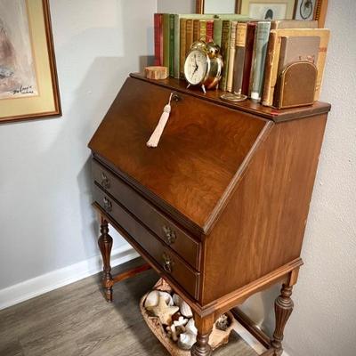 Antique secretary-style desk and vintage mirror