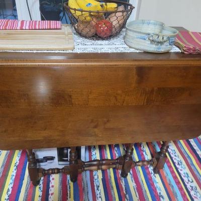 Antique, wooden droop leaf table