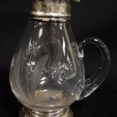 1124	WHEEL CUT GLASS SYRUP WITH STERLING TOP AND BASE, APPROXIMATELY 5 1/2 IN H
