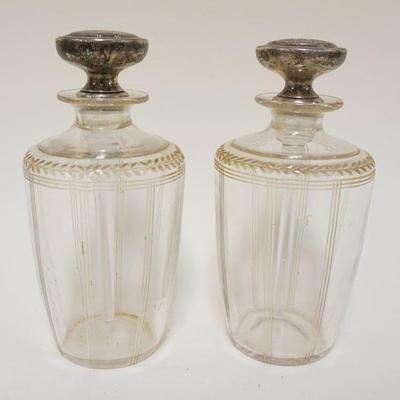 1012	PAIR OF PERFUMES WHEEL CUT W/STERLING TOPS, STOPPERS STUCK, APPROXIMATELY 7 IN HIGH

