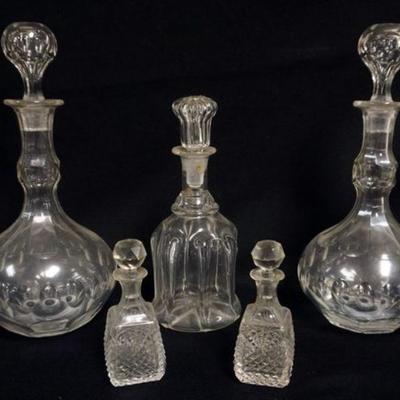 1123	LOT OF ANTIQUE GLASS DECANTORS AND CUT GLASS PERFUMES, LARGEST IS APPROXIMATELY 11 IN H
