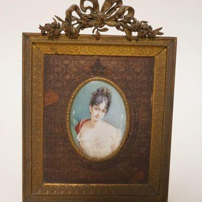1028	ARTIST SIGNED HAND PAINTED IMAGE OF YOUNG WOMAN IN ORNATE BRASS FRAME, APPROXIMATELY 5 1/2 IN X 7 1/2 IN
