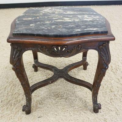 1223	CARVED WALNUT STAND WITH INSET MARBLE TOP, MARBLE HAS CRACK, APPROXIMATELY 21 IN X 21 IN H
