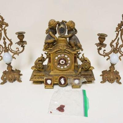 1262	VICTORIAN CAST METAL ZINC ALLOY CLOCK SET W/SOME DAMAGE TO A PIECE OF COLORED GLASS MEDALIONS, APPROXIMATELY 15 IN HIGH
