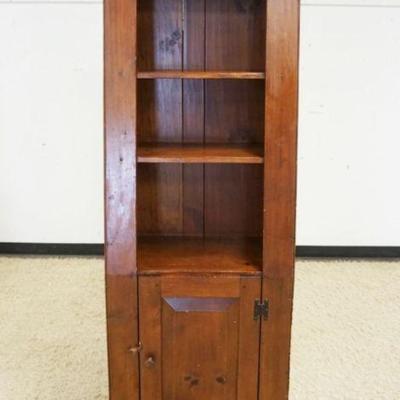 1201	PINE BENCH MADE COUNTRY SHELF WITH TAPPERED SIDES AND DOOR AT BASE, APPROXIMATELY 32 IN X 14 IN X 73 IN H
