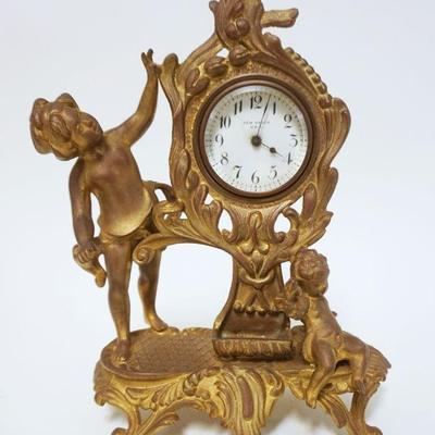 1065	NEW HAVEN CAST METAL FIGURAL CLOCK, APPROXIMATEL 9 IN HIGH
