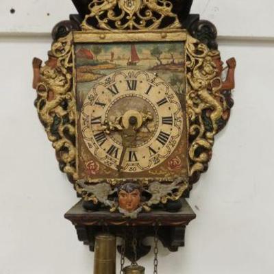 1014	CONTINENTAL OPEN WAG ON WALL CLOCK W/FRETWORK METAL EDGE OF RAMPANT LIONS & PAINT DECORATED FACE
