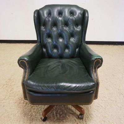 1195	GREEN LEATHER TUFTED BACK SWIVEL ARM CHAIR
