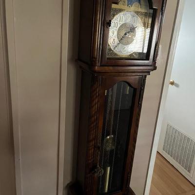 Grand mother clock. Bakers rack wine chest. 
