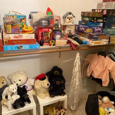 Collection of puzzles, games and stuffed animals