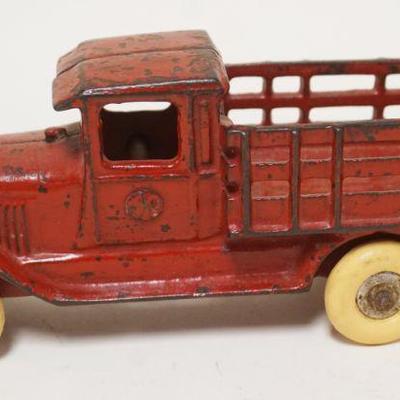 1166	ANTIQUE CAST IRON TOY TRUCK, APPROXIMATELY 2 1/4 IN X 7 IN X 3 IN HIGH
