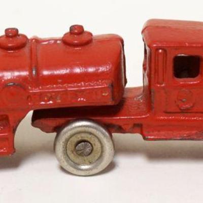 1121	ANTIQUE CAST IRON GASOLINE & OIL TOY TRUCK, APPROXIMATEL 1 1/2 IN X 5 1/2 IN X 1 3/4 IN HIGH
