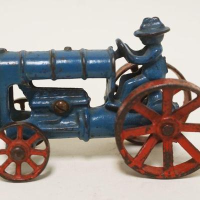 1183	ANTIQUE CAST IRON TOY TRACTOR, APPROXIMATELY 4 IN X 3 IN HIGH
