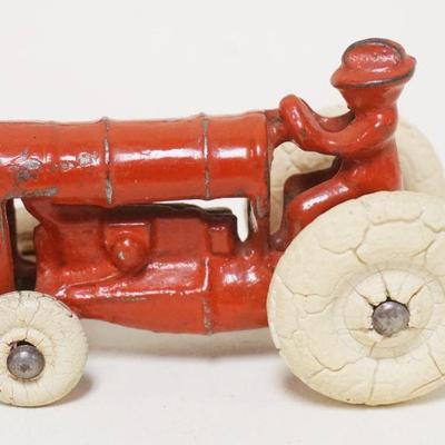 1182	ANTIQUE ARCADE CAST IRON TOY TRACTOR, APPROXIMATELY 4 IN X 2 1/2 IN HIGH
