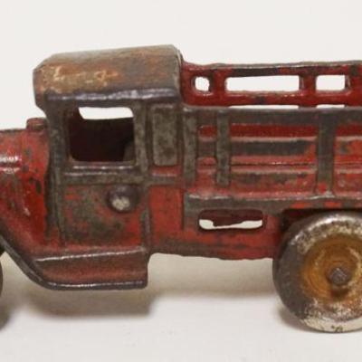 1112	ANTIQUE CAST IRON TOY TRUCK, APPROXIMATELY 5 IN X 1 1/2 IN X 2 IN
