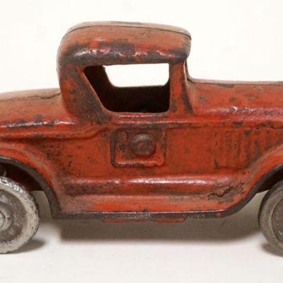 1122	ANTIQUE CAST IRON TOY CAR, APPROXIMATELY 2 IN X 5 IN X  2 IN HIGH
