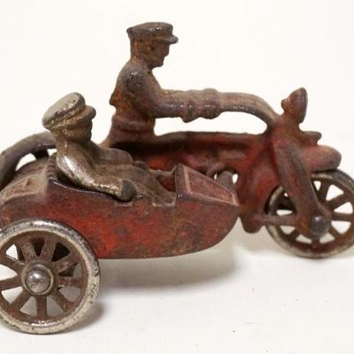 1128	ANTIQUE CAST IRON TOY MOTORCYLE W/SIDE CAR, APPROXIMATELY 5 IN X 3 IN HIGH
