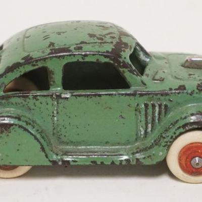 1175	ANTIQUE CAST IRON TOY CAR, APPROXIMATELY 4 1/4 IN LONG X 1 3/4 IN HIGH
