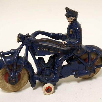 1134	ANTIQUE CAST IRON TOY MOTORCYLE COP MARKED CHAMPION
