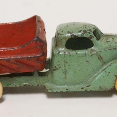 1167	ANTIQUE CAST IRON TOY DUMP TRUCK, APPROXIMATELY 1/2 IN X 6 IN X 2 IN HIGH

