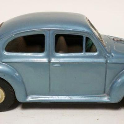 1145	TIN TOY FRICTION VOLKSWAGON BEETLE BUG JAPAN CAR, APPROXIMATELY 3 IN X 8 IN X 3 IN HIGH
