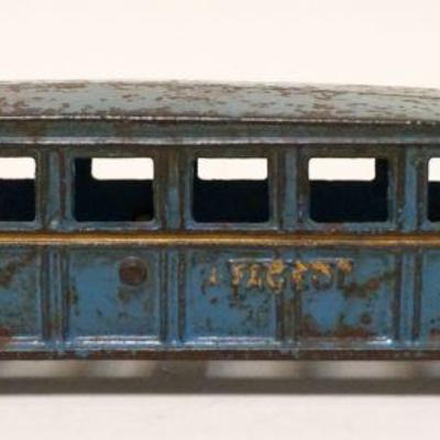 1125	ANTIQUE CAST ARCADE TOY BUS, APPROXIMATELY 2 IN X 8 IN X 2 1/4 IN HIGH
