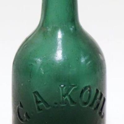 1085	ANTIQUE BEER BOTTLE G.A. KOHL, EASTON PA, BUBBLE IN GLASS AT BOTTOM, APPROXIMATELY 7 1/2 IN HIGH

