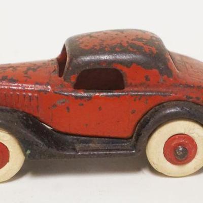 1173	ANTIQUE CAST IRON TOY CAR, APPROXIMATELY 5 IN X 1 3/4 IN HIGH
