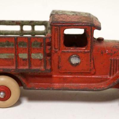 1124	ANTIQUE CAST IRON TOY STAVE BODY TRUCK, APPROXIMATELY 2 1/4 IN X 7 IN X 3 IN HIGH
