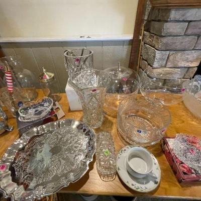 Crystal dining ware items ranging from bowls, platters, butter dish, vases, etc. 